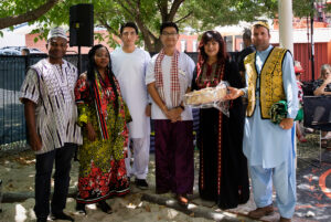 Group of people standing together outside.