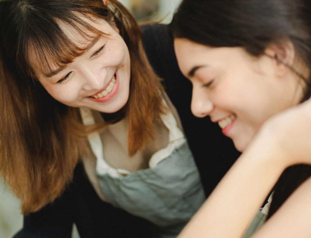 Two women talking together.