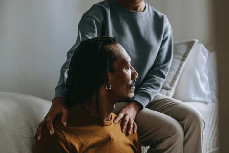 Woman consoling a man.