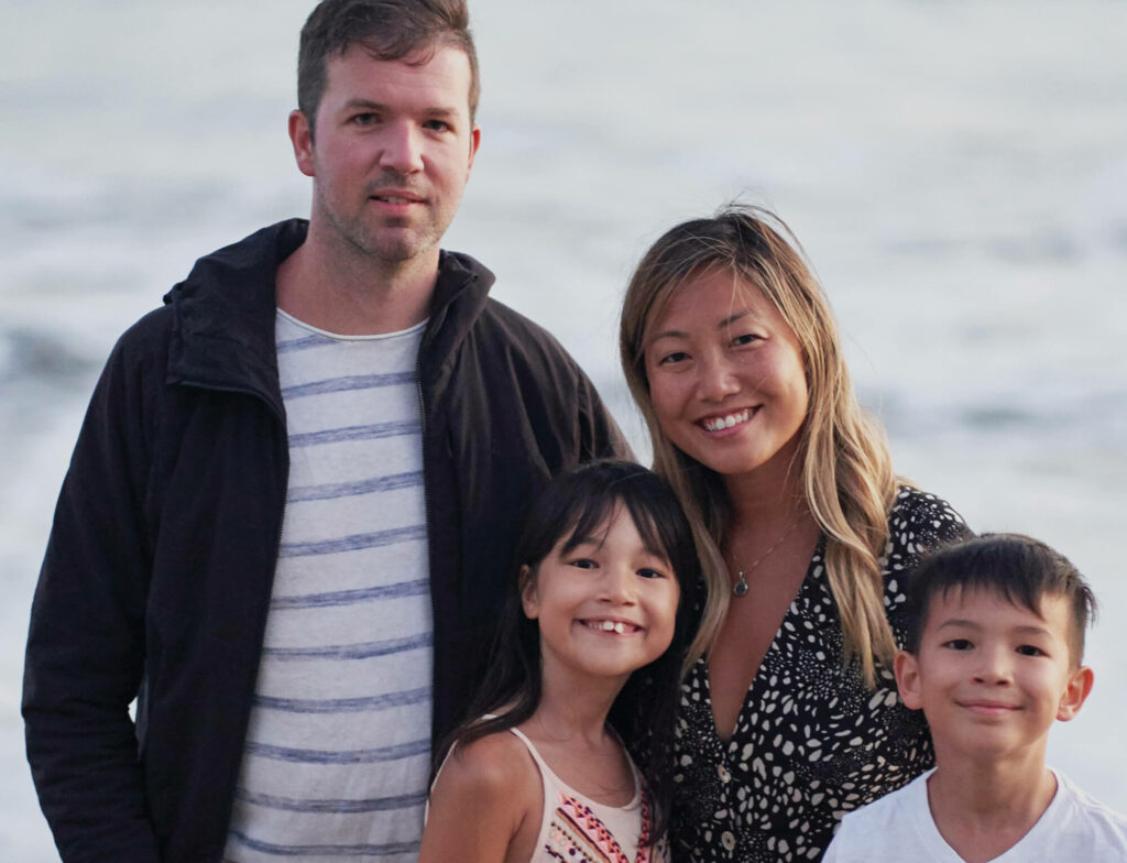 Family of four at the beach.