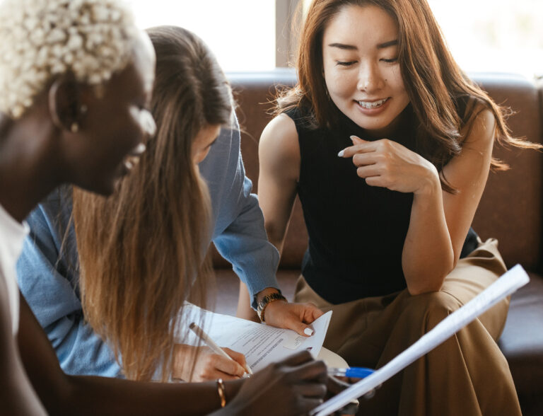 Diverse group of women talking to each other.