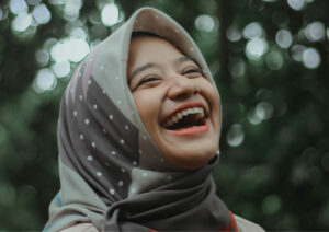 Woman smiling looking upwards.