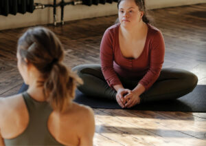 Two women in a yoga session.
